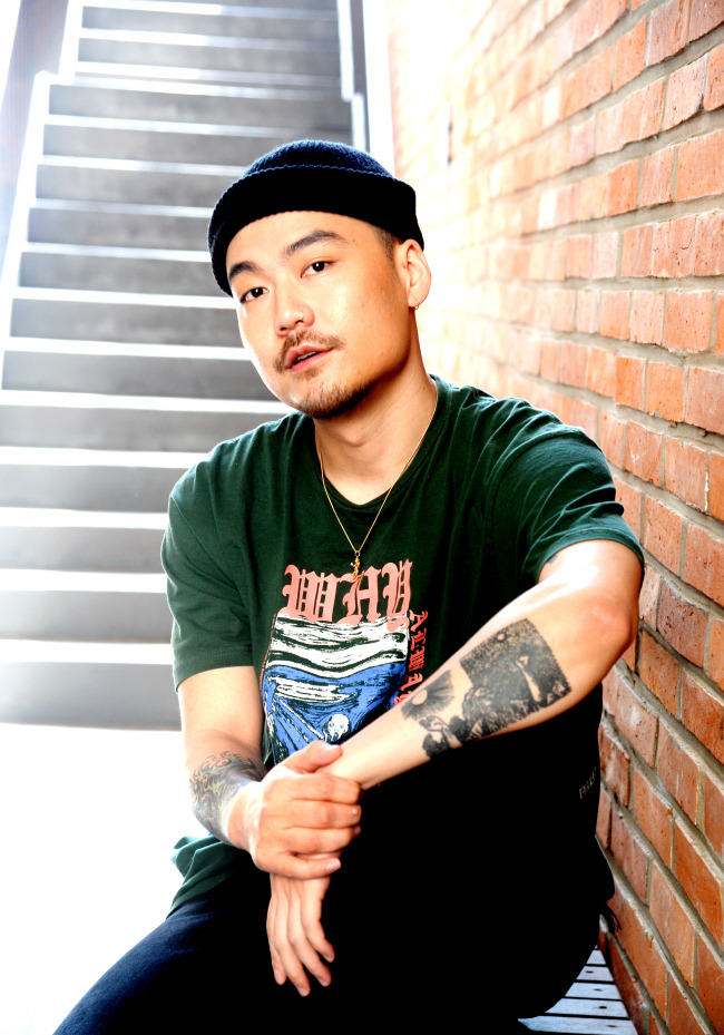 Rapper Dumbfoundead (Park Sung-man) poses for a photo before an interview at Herald Square on Thursday. (Park Hyun-koo/The Korea Herald)