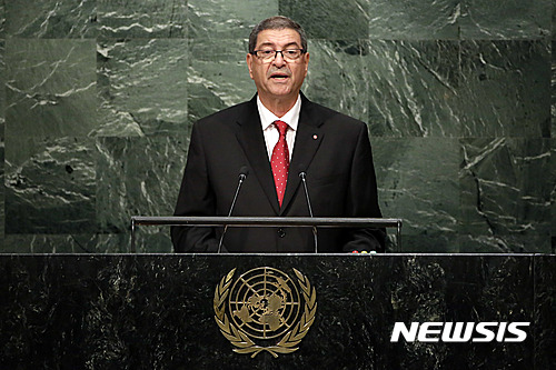 FILE- In this Sept. 27, 2015, file photo, Habib Essid, Head of Government of Tunisia, addresses the 2015 Sustainable Development Summit at United Nations headquarters. Tunisia's parliament passed a vote of no confidence in Prime Minister Habib Essid on Saturday, July 30, effectively disbanding the government of the U.S.-trained agricultural economist. (AP Photo/Richard Drew, File)