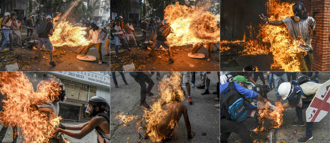 스토리부문 3위. 베네수엘라 시위중 오토바이 연료통이 폭발하면서 불붙은 시위대. AFP연합뉴스