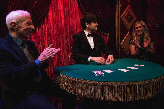Magician Ed Kwon performs magic at The Magic Castle in Los Angeles, California in December 2017.