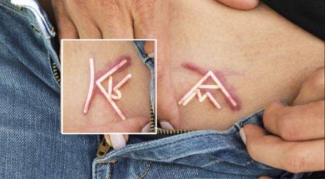 넥시움 사건 피해 여성들의 몸에 새겨진 이니셜. 유튜브 캡처