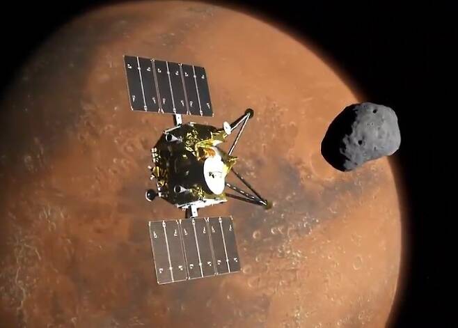 화성의 위성에 접근하는 MMX 탐사선