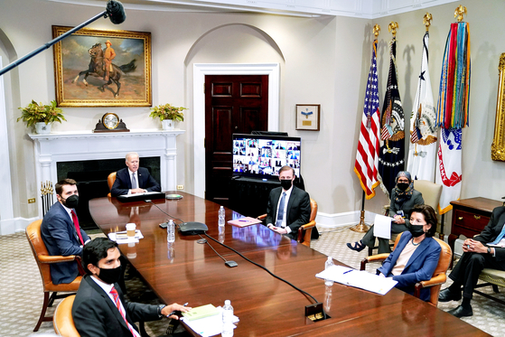 U.S. President Joe Biden speaks during the virtual CEO summit on semiconductor and supply chain at the White House on Monday. [EPA/YONHAP]