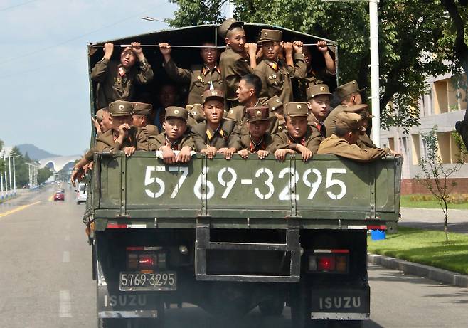 Soldiers are transported on back of a truck in Pyongyang in August 2018. (Lindsey Miller)