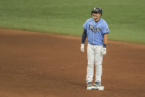 Tampa Bay Rays' Choi Ji-man smiles at second base after hitting an RBI-double off New York Mets reliever Edwin Diaz during the eighth inning in St. Petersburg, Florida on Sunday. [AP/YONHAP]