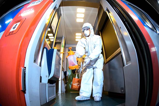 An employee sanitizes a KTX-Eum train. (Korail)