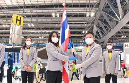 Athletes, coaches and staff of the Thailand Olympic team wear the second generation LG PuriCare Wearable Air Purifier as they depart for the Tokyo Olympics on July 23. [LG ELECTRONICS]
