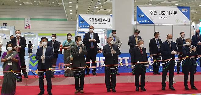 TRADE PARTNERS -- Ambassadors and representatives of the embassies and Korea Importers Association inaugurate the 18th Import Goods Fair that was held Thursday to Saturday at Coex in Seoul. The fair was organized by the Korea Importers Association to showcase new products imported from partner countries. Forty embassies and 22 foreign companies attended as part of the fair. (Embassy of Bangladesh in Seoul)