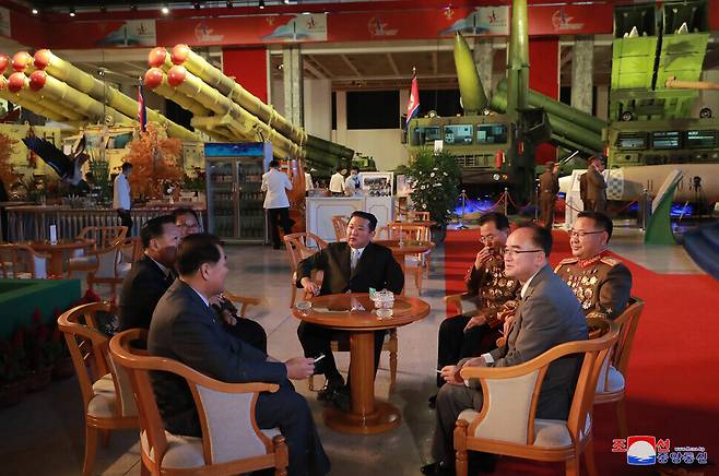 North Korean leader Kim Jong-un sits with high-level officials including Chief of the Academy of the National Defence Science Jang Chang-ha (seated to the right of Kim Jong-un) and member of the Presidium of the WPK Politburo Jo Yong-won (front row, right). (KCNA/Yonhap News)