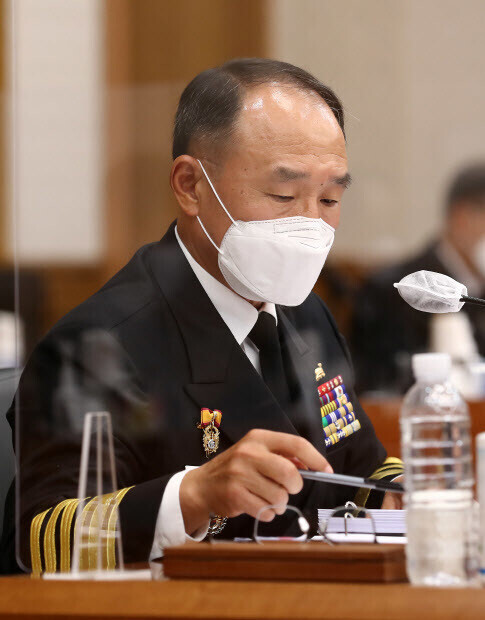 ROK Navy Chief of Staff Boo Suk-jong refers to prepared notes during a parliamentary audit of ROK Navy headquarters by the National Assembly’s National Defense Committee, held at the Gyeryong complex in Chungcheong Province on Thursday afternoon. (Yonhap News)