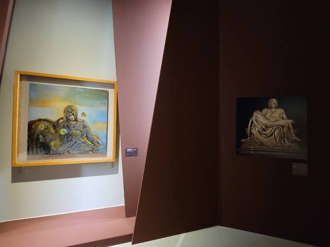 “Geological Echo, After ‘Pieta’” by Salvador Dali (left) is on display at DDP in Seoul (Park Yuna/The Korea Herald)