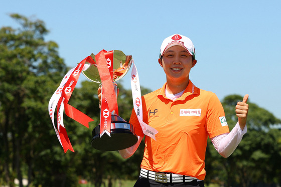 Kim Hyo-joo poses with the winner's trophy after winning the 2021 HSBC Women's World Championship at Sentosa Golf Club in Singapore on May 3, 2021. [AFP/YONHAP]