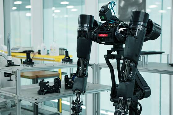 Ambidex, a robot with two arms, was jointly developed by Naver Labs and Korea University of Technology & Education and will be used for keeping delivery robots clean. [NAVER]