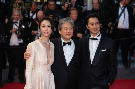 From left; Actor Tang Wei, director Park Chan-wook and actor Park Hae-il on the red carpet at the 75th Cannes Film Festival in Cannes, southern France [NEWS1]