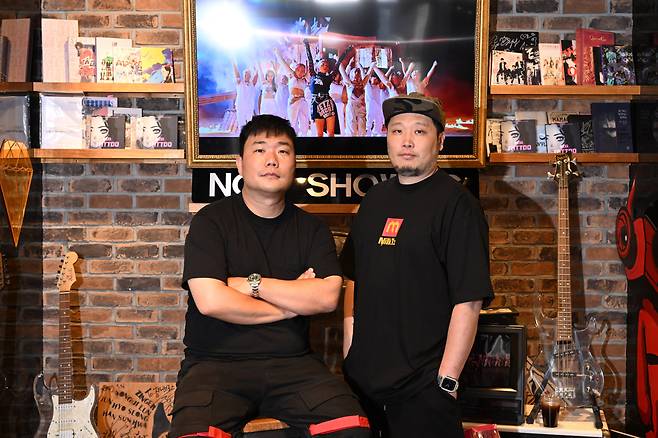 Kim Jun-hong (left) and Hong Won-ki, co-CEOs and co-founders of Zanybros, pose for photos during an interview with The Korea Herald at the K-pop music video production company’s headquarters in southern Seoul. (Im Se-jun/The Korea Herald)