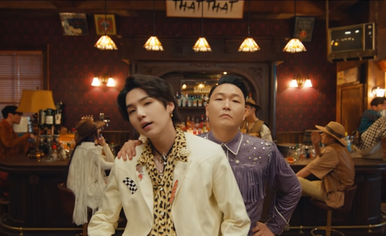 Suga of BTS in the music video for PSY's latest lead track "That That" (2022), which Suga produced and featured in. [SCREEN CAPTURE]
