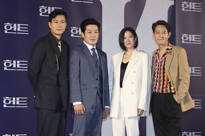 From left: Jung Woo-sung, Heo Sung-tae, Jeon Hye-jin and Lee Jung-jae pose for photos after a press conference introducing “Hunt” at Megabox Seongsu in Seoul, Tuesday. (Yonhap)