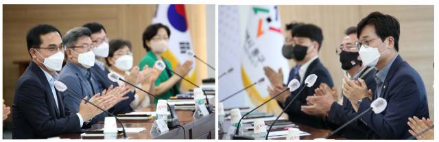 박희조(왼쪽 첫번째) 동구청장과 장철민(오른쪽 첫번째) 민주당 국회의원이 간담회에서 국비 확보 등 대응 방안을 논의한 뒤 박수를 치고 있다. 사진제공=동구