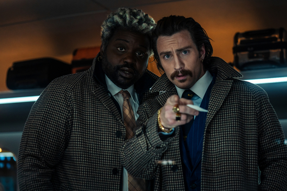 Beside Tangerine, on the left, is Lemon, portrayed by Brian Tyree Henry. The duo are referred to as "The Twins." [SONY PICTURES]