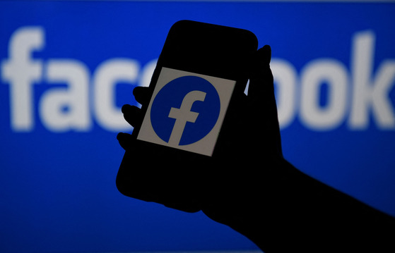 A smartphone screen displays the logo of Facebook [YONHAP]