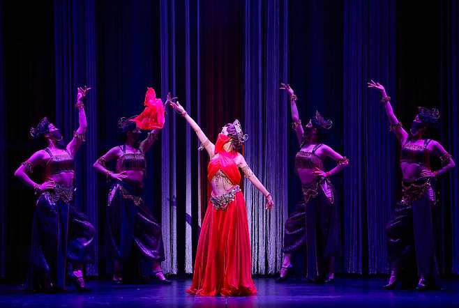 Solar (center) performs with dancers in “Mata Hari.” (EMK Musical Co.)