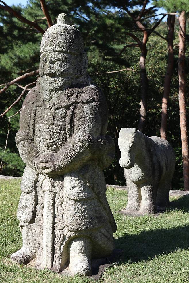 A stone statue of a warrior with a horse guards the royal tombs of the last king of the Goryeo Empire and Joseon founder Yi Seong-gye in Guri, Gyeonggi Province. Photo © Hyungwon Kang