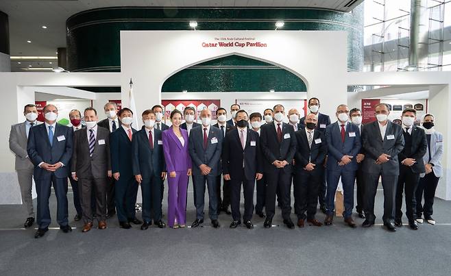 Representatives of the Diplomatic Corps and guests pose for a group photo at the opening ceremony of the Qatar World Cup Pavilion at Coex lobby in southern Seoul on Monday.(Korea-Arab Society)