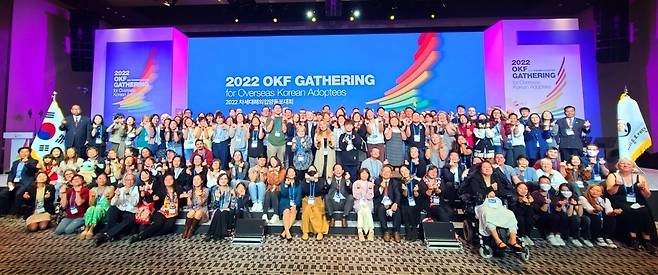 Participants in the 2022 Gathering for Overseas Korean Adoptees pose for a picture at an opening ceremony held at Seoul Dragon City, Yongsan-gu, Seoul, Thursday. (Yonhap)