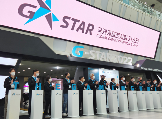 Officials from the Ministry of Culture, Sports and Tourism, the Korea Association of Game Industry (K-Games), Busan city government and participating companies stand for photos during the opening ceremony of G-Star 2022 held at Bexco, Busan, on Thursday morning. [YONHAP]