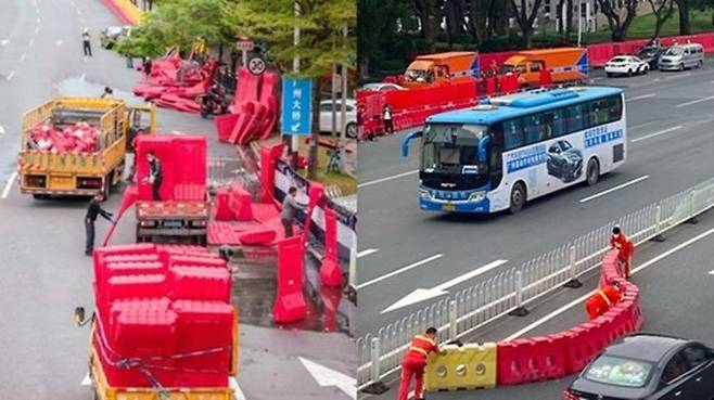 지난달 30일 중국 광둥성 광저우에서 차량 통제용 도로 가림막 철거작업을 하고 있는 모습. ⓒ 연합뉴스