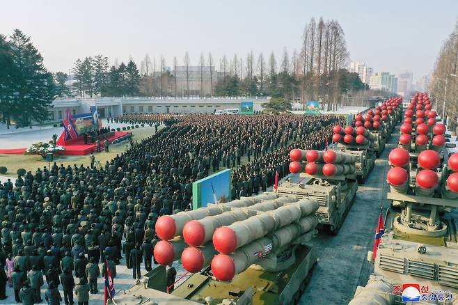 This photo, carried by North Korea's official Korean Central News Agency on Jan. 1, 2023, shows the North holding a ceremony to present its new super-large multiple rocker launcher to a plenary meeting of the ruling Workers' Party of Korea last week. (Yonhap)