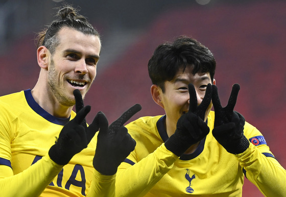 Gareth Bale, left, and Son Heung-min celebrate a goal for Tottenham Hotspur against Wolfsberger AC in the Europa League on Feb. 18, 2021.  [EPA/YONHAP]