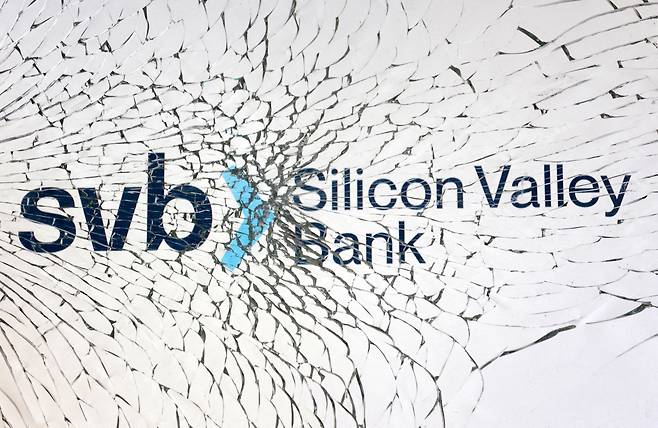 FILE PHOTO: SVB (Silicon Valley Bank) logo is seen through broken glass in this illustration taken March 10, 2023. REUTERS/Dado Ruvic/Illustration/File Photo