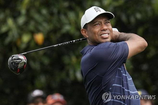 Tiger Woods watches his tee shot on the ninth hole during the second round of the Masters golf tournament at Augusta National Golf Club on Friday, April 7, 2023, in Augusta, Ga. (AP Photo/Mark Baker)