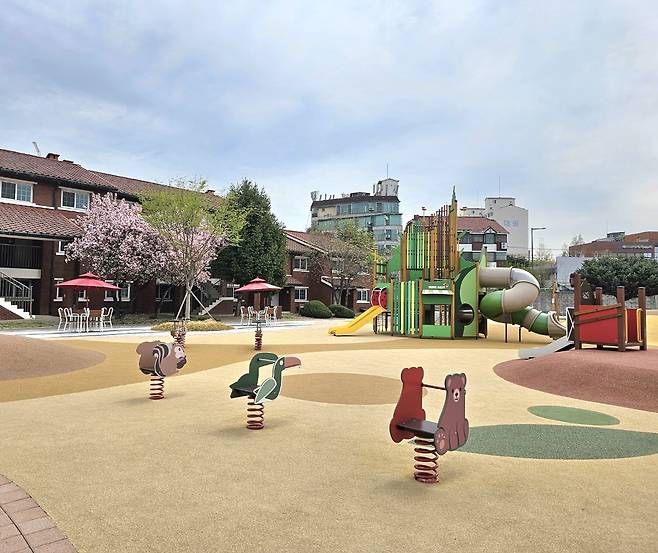 A playground for children with slides and seesaws (Choi Jae-hee / The Korea Herald)