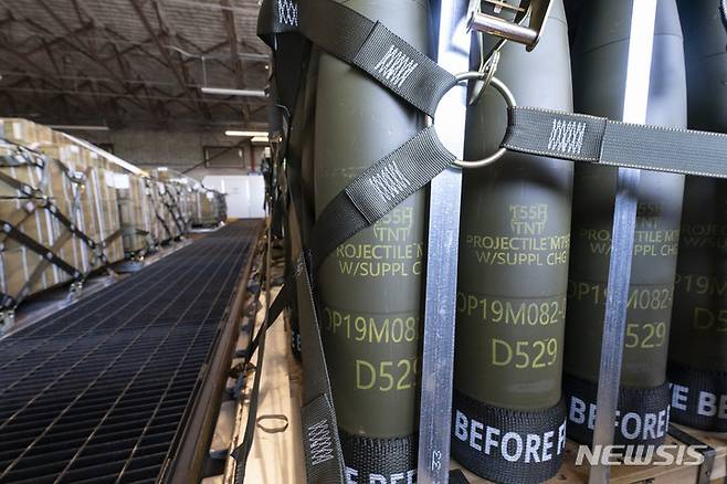 FILE - Pallets of 155 mm shells ultimately bound for Ukraine are loaded by the 436th Aerial Port Squadron, Friday, April 29, 2022, at Dover Air Force Base, Del. U.S. officials say that as Russia’s war on Ukraine drags on, U.S. security assistance is shifting to a longer-term campaign that will likely keep more American military troops in Europe into the future. They say a new aid package to be announced includes an additional roughly $3 billion to train and equip Ukrainian forces to fight for years to come. (AP Photo/Alex Brandon, File)