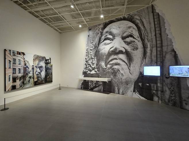 An installation view of the exhibition's "The Wrinkles of the City" section at JR's solo exhibition at the Lotte Museum of Art in Seoul (Park Yuna/The Korea Herald)