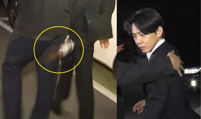 한 남성이 던진 커피를 맞고 표정이 굳은 유씨. SBS ·연합뉴스TV 보도화면 캡처