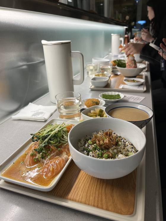 A Japanese meal set with salmon, soup and side dishes at a restaurant in Seoul. [SOFIA DEL FONSO]