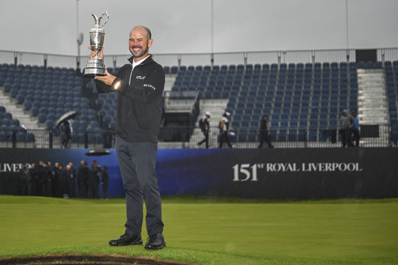 Brian Harman smiles with the Claret Jug trophy following his six stroke victory in the final round of The 151st Open Championship at Royal Liverpool Golf Club in Hoylake, England on July 23.  [GETTY IMAGES]