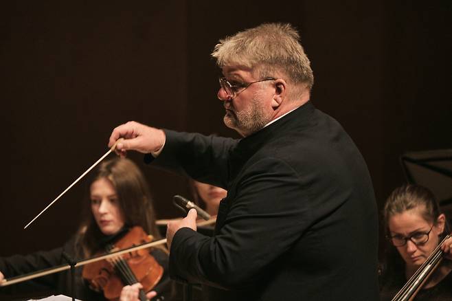 Dmitry Yablonsky, Kyiv Virtuosi's cellist and conductor, leads the orchestra during a concert on Saturday at Alpensia Concert Hall in Pyeongchang, Gangwon Province. (Music In Pyeongchang)