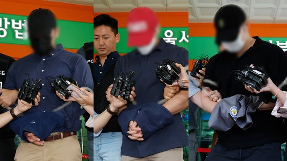 Three suspects who allegedly used drugs at an apartment building in Yongsan District, central Seoul, where a police officer fell to his death on Aug. 27, are escorted from the Seoul Western District Court in Mapo District, western Seoul, on Monday after attending arrest warrant hearings. [NEWS1]