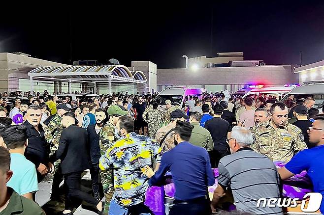 27일(현지시간) 오전 이라크 북부 니네베주(州) 함다니야 지역에서 열린 결혼 축하 행사에서 화재가 발생해 최소 100명이 사망하고 150명이 부상했다. 2023.09.27. ⓒ AFP=뉴스1 ⓒ News1 정윤영 기자