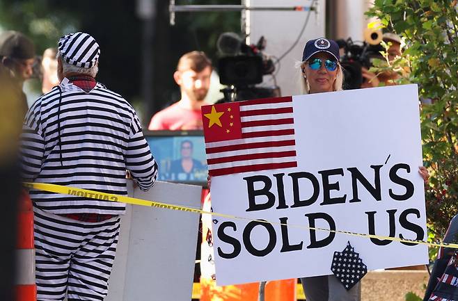 People protest outside the courthouse as U.S. President Joe Biden's son, Hunter Biden is to appear in a federal court on gun charges in Wilmington, Delaware, U.S., October 3, 2023. REUTERS/Mike Segar