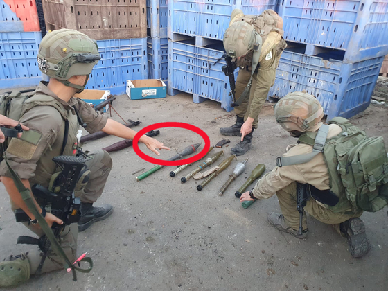 A photo of weapons confiscated by the Israel Defense Forces (IDF) shows what appears to be a North Korean F-7 rocket, circled in red. The photo is a screen grab from the IDF's website. [SCREEN CAPTURE]