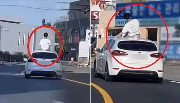 지난달 23일 오후 2시쯤 경기 파주시 인근 도로에서 한 남성이 차량 지붕에 걸터앉아 가는 모습이 포착됐다. [사진=유튜브 '한문철TV']