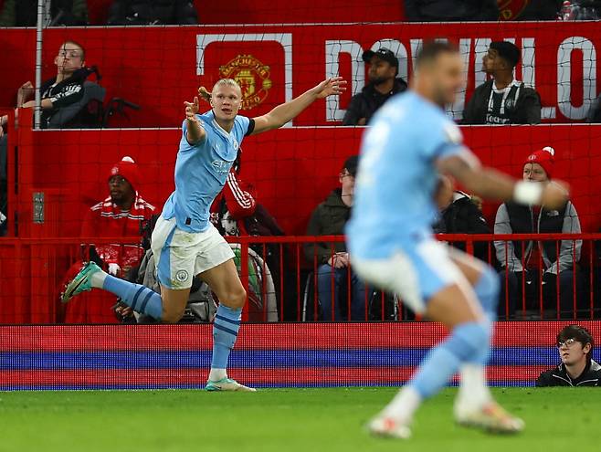 Soccer Football - Premier League - Manchester United v Manchester City - Old Trafford, Manchester, Britain - October 29, 2023  Manchester City's Erling Braut Haaland celebrates scoring their second goal REUTERS/Molly Darlington NO USE WITH UNAUTHORIZED AUDIO, VIDEO, DATA, FIXTURE LISTS, CLUB/LEAGUE LOGOS OR 'LIVE' SERVICES. ONLINE IN-MATCH USE LIMITED TO 45 IMAGES, NO VIDEO EMULATION. NO USE IN BETTING, GAMES OR SINGLE CLUB/LEAGUE/PLAYER PUBLICATIONS.