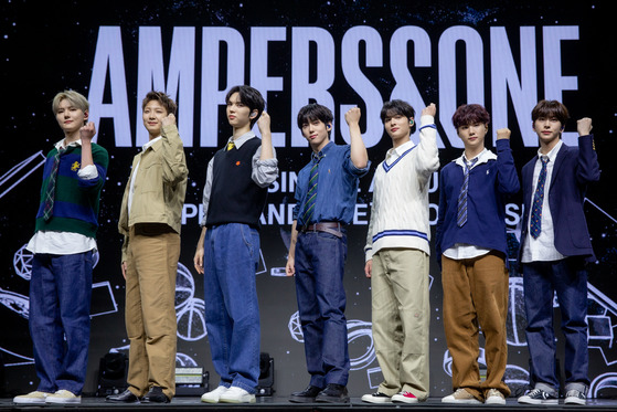 Ampers&One, FNC Entertainment's new seven-member boy band, poses for the camera during its debut showcase at the Blue Square in Yongsan District, central Seoul. [FNC ENTERTAINMENT]