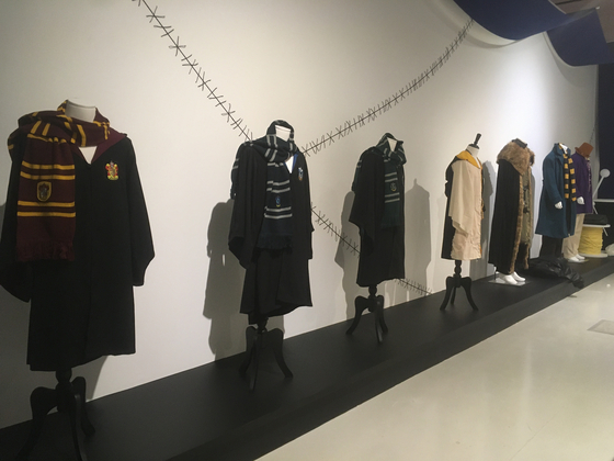 Costumes from films such as the ″Harry Potter″ series and more are on display at the ″Celebrating Every Story″ exhibition at the Dongdaemun Design Plaza in Dongdaemun District, central Seoul, on Nov. 17, a day before the official opening of the exhibition. [LIM JEONG-WON]