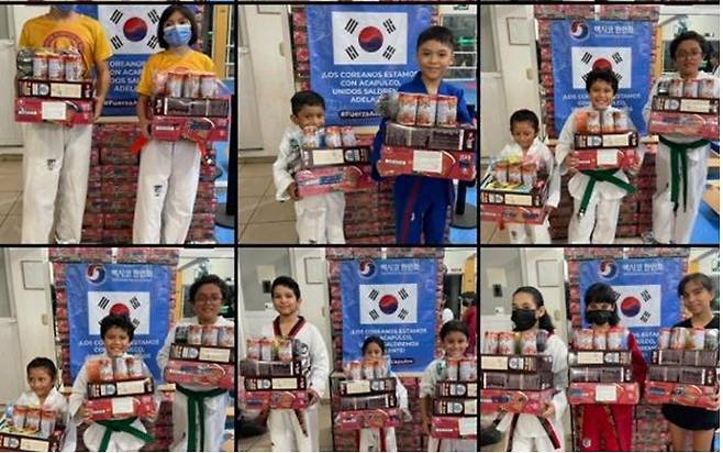 멕시코 한인회에서 전달한 구호품을 든 아카풀코 태권도장 아이들 [멕시코 한인회 제공. 재판매 및 DB 금지]